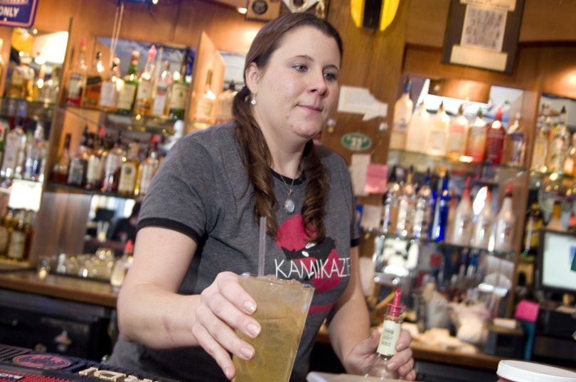 In this Jan. 25, 2010 photo, bartender Amber Dawn McCarrel serves a mixed drink at  Elliott's Sports Pub and Grill  in Nampa, Idaho bar. The Nampa City Council voted to lift the city's prohibition on Sunday liquor sales in restaurants and bars last month. Currently, restaurants and bars can only sell beer and wine on Sundays.  The new rules go into effect on Sunday Jan. 31, 2010 in Idaho's second biggest city. (Greg Kreller / Idaho Press-tribune)