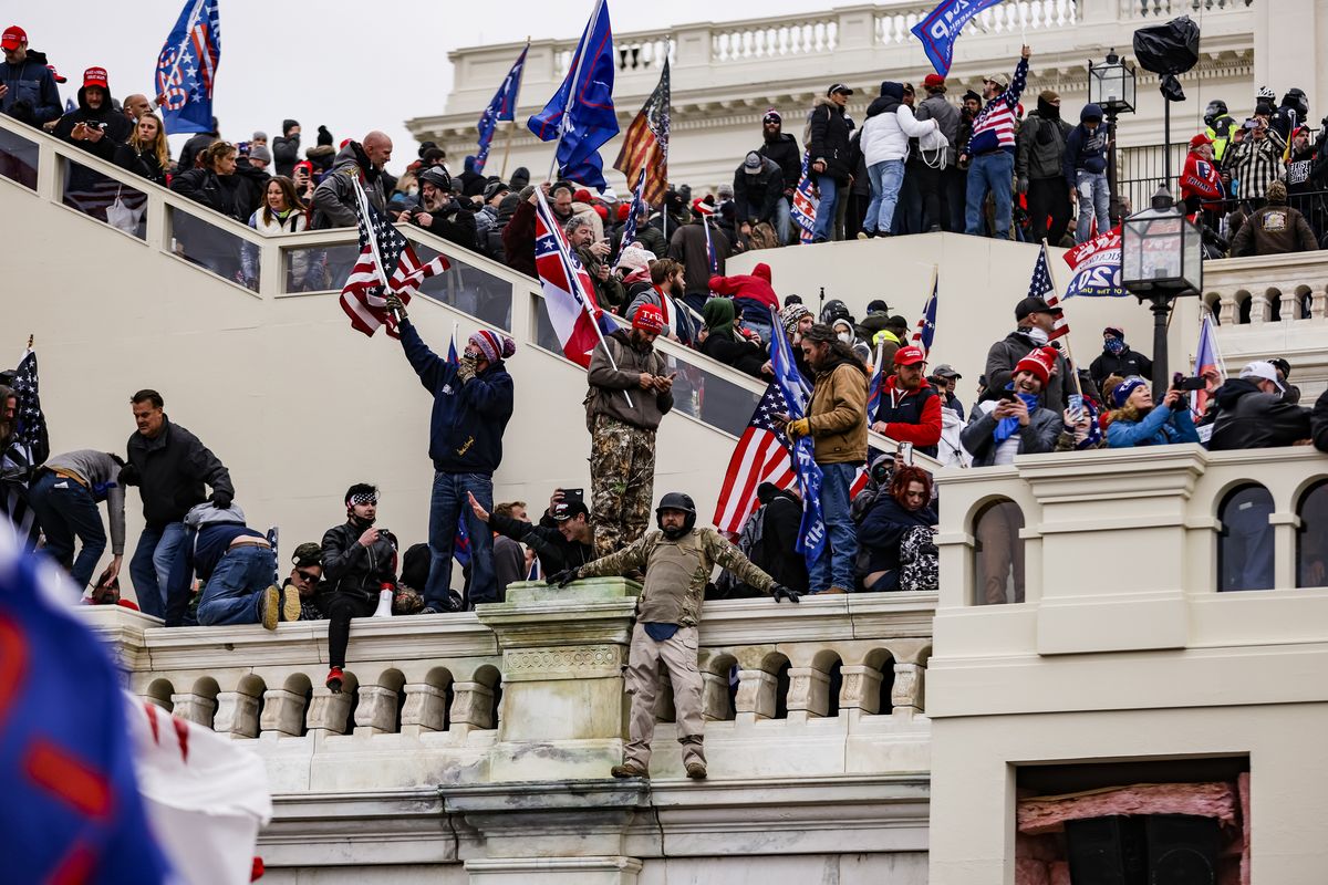 Pro-Trump supporters storm the U.S. Capitol following a rally with President Donald Trump on Wednesday, Jan. 6, 2021 in Washington, D.C.  (Samuel Corum/Getty Images North America/TNS)
