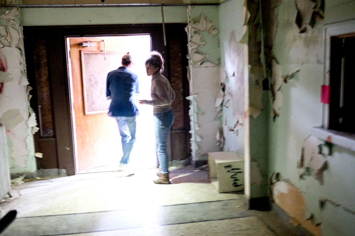 Austin and Laura Storm open the front doors to the closed St. Ignatius Hospital on Thursday in Colfax, Wash. The Storms recently bought the abandoned building.  (Tyler Tjomsland/The Spokesman-Review)