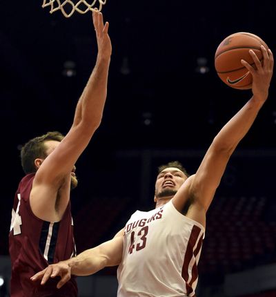 Washington State forward Drick Bernstine drives the basket as IUPUI forward Evan Hall defends on the play in the first half of an NCAA college basketball game, Saturday in Pullman. (Pete Caster / AP)