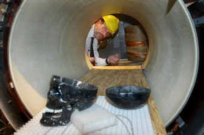 
Howard Bassen looks through one end of the MRI coil in his lab at the FDA's office of Science and Technology in Rockville, Md. 
 (Associated Press / The Spokesman-Review)