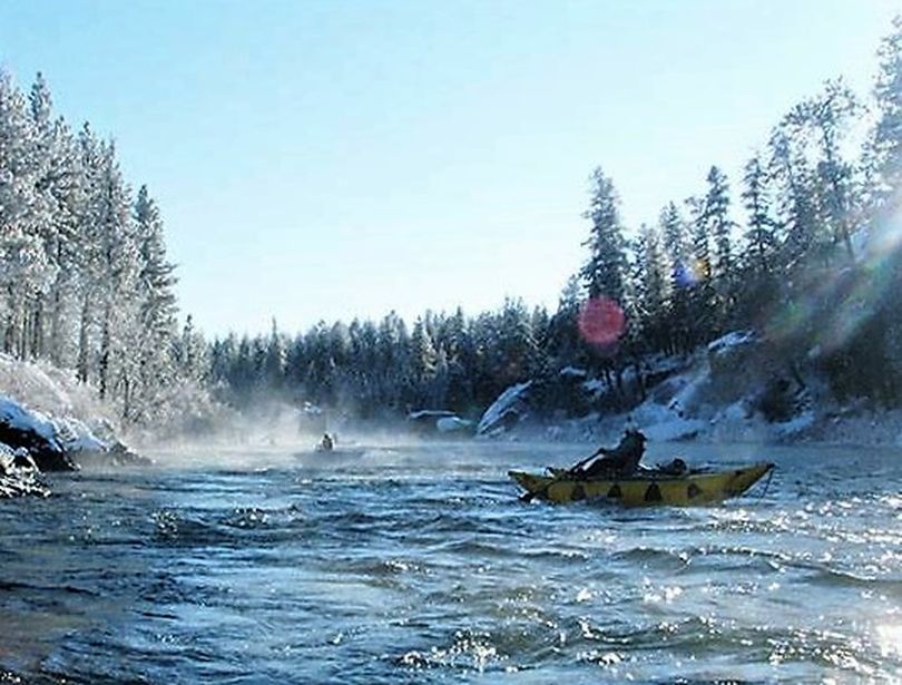Rafters descend the Spokane River near Devil's Toenail Rapid with temperatures in the teens on New Years Day 2016. (Paul Delaney)