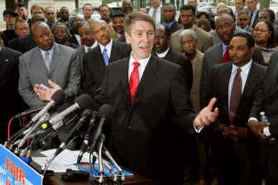Senate Majority Leader Bill Frist, R-Tenn., center, speaks as black religious leaders look on at a rally in support of Janice Rogers Brown, President Bush's nominee to the U.S. Court of Appeals for the D.C. Circuit, at Russell Park on Capitol Hill on Thursday. Frist said he will call a vote next week on whether Republican senators are willing to let the minority Democrats continue to block the White House's judicial appointments through filibusters. 
 (Associated Press / The Spokesman-Review)