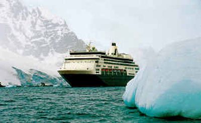 
Approaching a large iceberg, a cruise ship sails through Antarctic waters in January 2000. 
 (File/Associated Press / The Spokesman-Review)