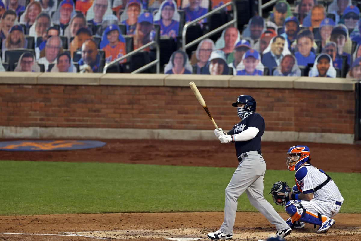 The New York Yankees’ Clint Frazier, left, watches his two-run home run against the New York Mets during the fourth inning of a baseball spring training game  (Associated Press)