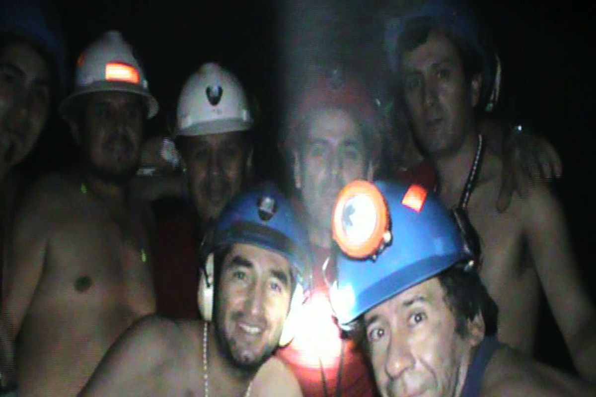 In this TV image taken from a video released by Chile’s presidency, trapped miners celebrate inside the San Jose mine  on Friday.  (Associated Press)
