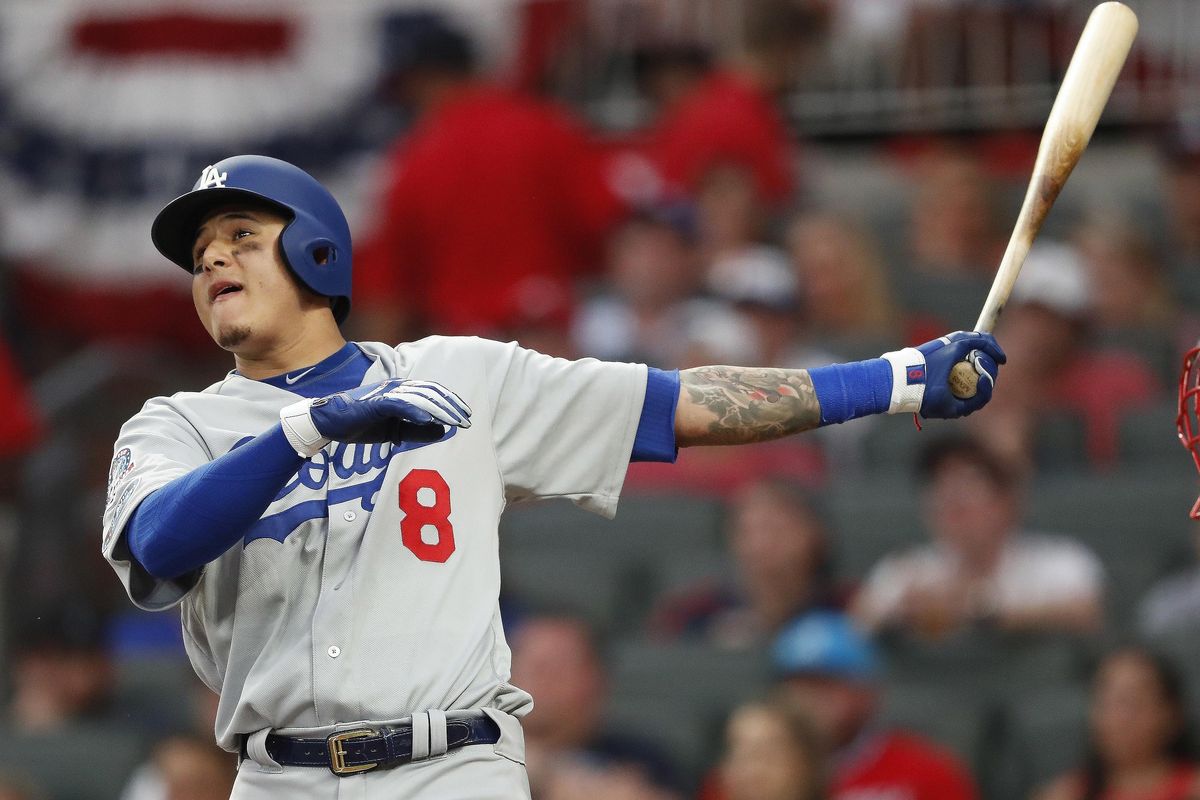 Los Angeles Dodgers shortstop Manny Machado  watches his three-run homer against the Atlanta Braves during the seventh inning  Monday  in Atlanta. (John Bazemore / AP)