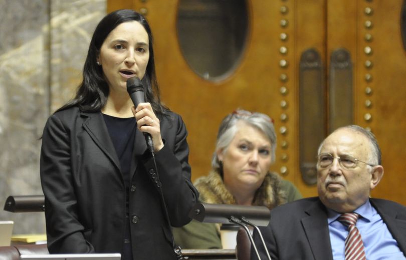 OLYMPIA -- Sen. Rebecca Saldana, D-Seattle, argues against changing state driver's licenses to comply with the federal the REAL ID laws during a debate Tuesday while Sens. Steve Conway and Maureen Walsh look on (Jim Camden/The Spokesman-Review)