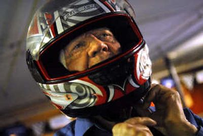 
J.R. Cox puts on his helmet at FastKart Indoor Speedway. 
 (Holly Pickett / The Spokesman-Review)
