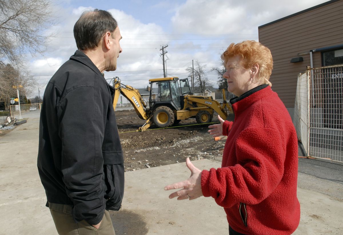The Spokesman-ReviewSpokane Valley Partners CEO Ken Briggs and Spokane Valley Partners food bank director Barb Bennett watch as construction crews begin site preparation for the new warehouse. (J. Bart Rayniak / The Spokesman-Review)