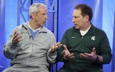 Coaches Roy Williams, left, and Tom Izzo have contrasting styles. (Associated Press / The Spokesman-Review)