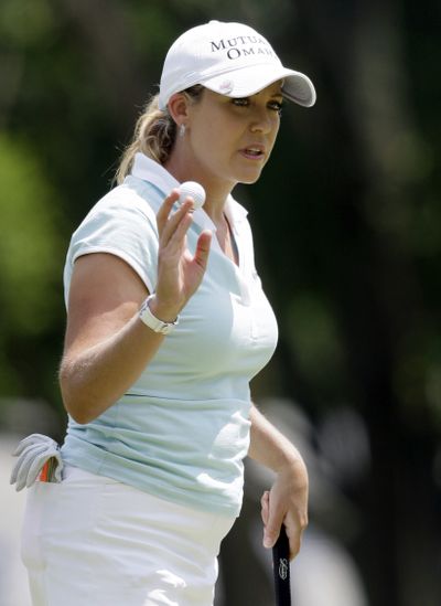 Second-round leader Cristie Kerr waves to the gallery after putting out on the 10th hole at the U.S. Women’s Open on Friday. (Associated Press / The Spokesman-Review)