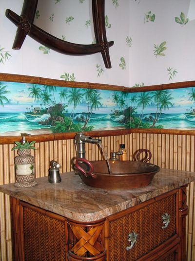 This wallpaper border with palm trees added the right touch to this powder room. (Tim Carter)