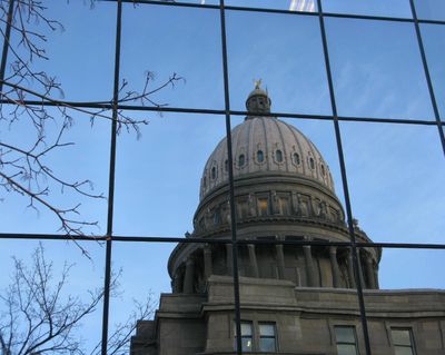 Idaho’s state Capitol is reflected in the Joe R. Williams state office building across the street, also known as the “Hall of Mirrors” (Betsy Z. Russell)
