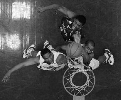 
Oregon's Bryce Taylor, top, fights for rebound Saturday against Stanford's Carlton Weatherby, left, and Lawrence Hill. 
 (Associated Press / The Spokesman-Review)