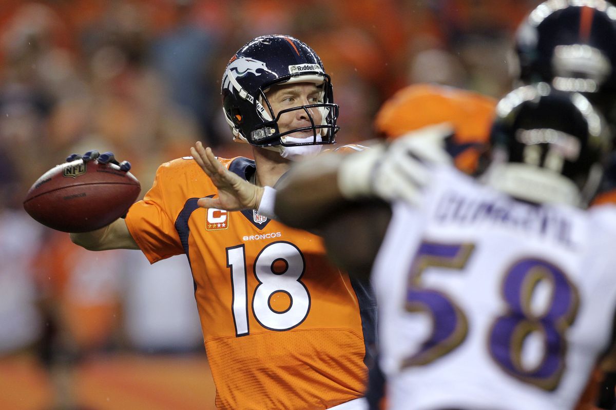 Broncos quarterback Peyton Manning tied an NFL record for touchdown passes – seven – that hadn’t been matched in 44 years. (Associated Press)