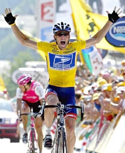
Tour de France winner Lance Armstrong, of Austin, Texas, reacts as he crosses the finish line to win the 17th stage of the Tour de France cycling race between Bourd-d'Oisans and Le Grand Bornand, French Alps in 2004. 
 (File Assocated Press / The Spokesman-Review)