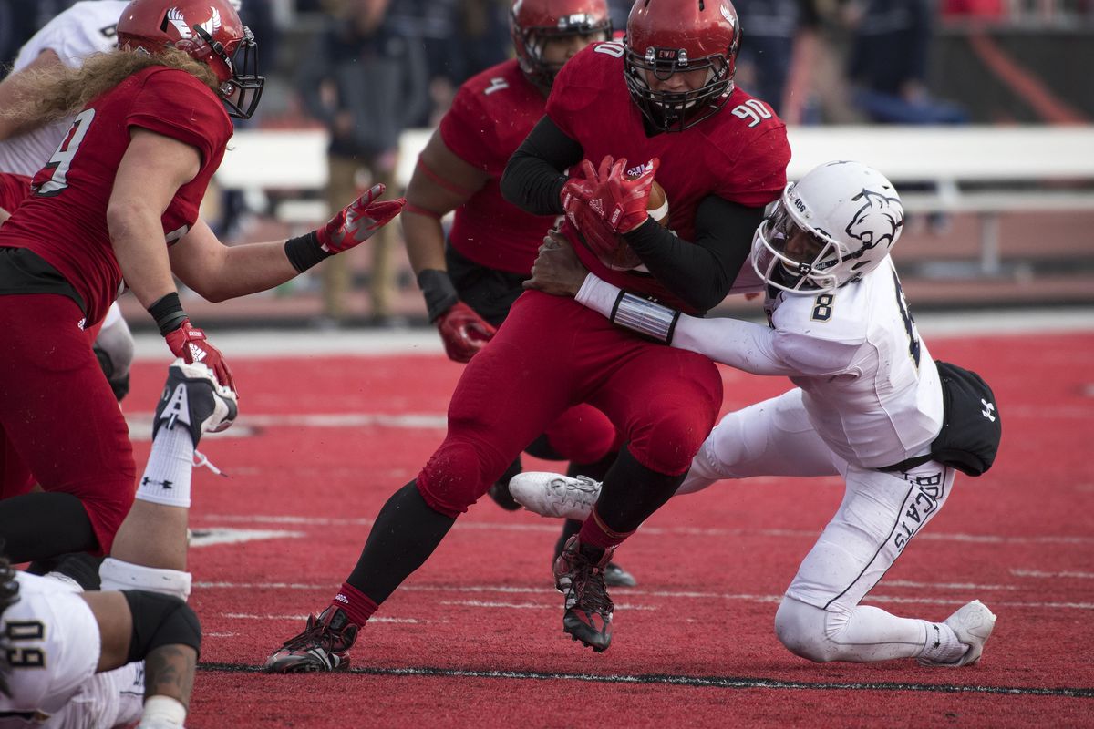 After Montana State quarterback Chris Murray (8) fumbles, Eastern Washington defensive lineman Keenan Williams  recovers the ball during  a  game on  Oct. 14, 2017, in Cheney. (Colin Mulvany / The Spokesman-Review)