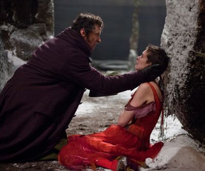 Hugh Jackman as Jean Valjean, left, and Anne Hathaway as Fantine in a scene from “Les Miserables.”