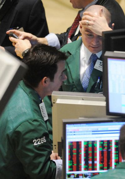 
Marco Picone, right, and Michael McDonnell, of Lehman Brothers MarketMakers, consult at the New York Stock Exchange on Friday.Associated Press
 (Associated Press / The Spokesman-Review)