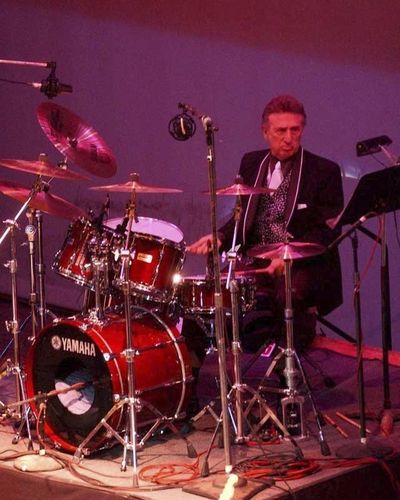 In this Oct. 16, 2004 file photo, longtime Elvis Presley drummer D.J. Fontana performs at the 50th anniversary celebration concert of Elvis Presley's first performance at the Louisiana Hayride in Sherveport, La. (Robert Ruiz / Associated Press)