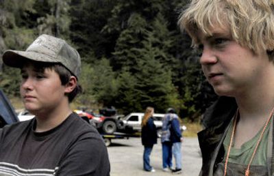 
Bowhunters Jeremy Rohrbach, left, and Logan Young, both 14, of Hayden, were found in the woods near Wolf Lodge saddle on Monday morning.  They had been missing since  Sunday evening. 
 (Kathy Plonka / The Spokesman-Review)