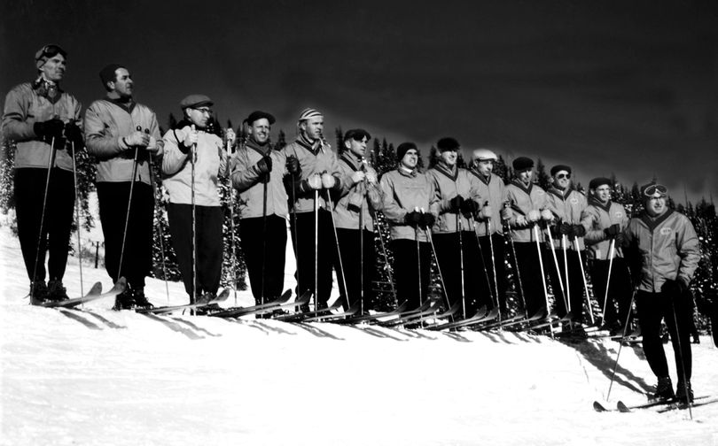 Ready for the 1955-56 ski season to begin on Mt. Spokane  these Spokesman-Review ski school instructors pose for a group photo.  Left to right are Dick Williams, Ron Lemmer, Durward DeChenne, Bob Burkhardt, Floyd Deaver, Ray Brian, Bert Fisher, Jack Malone, Nick Simchuk, Art Swanson, Ellis Wickward, Bobby O'Brien.  In front of the group is Bob Campbell, Chief Instructor. (Photo Archives/The Spokesman-Review)