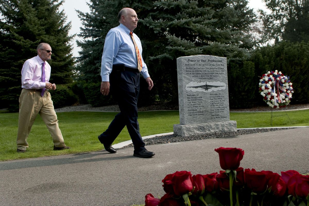 Larry Frazier, left, and Greg Staples walk away after saying a few words to the crowd during the B-52 Memorial Dedication at Memorial Park at Fairchild  Air Force Base on Friday. (Kathy Plonka / The Spokesman-Review)