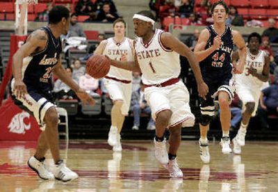 
Josh Akognon, center, has Lewis-Clark State players on the run in a game early last season. Now at Cal State Fullerton, he says he has enjoyed keeping an eye on WSU's remarkable run this season. 
 (File / The Spokesman-Review)