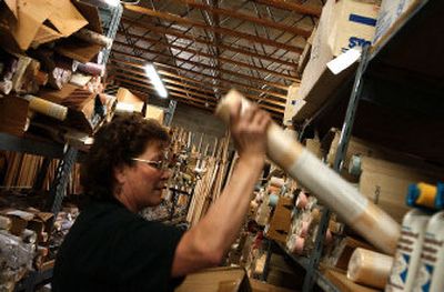 
Habitat for Humanity Surplus Store employee, Margaret Thompson, stocks the shelves of the store with wallpaper. 
 (Photos by Jed Conklin/ / The Spokesman-Review)