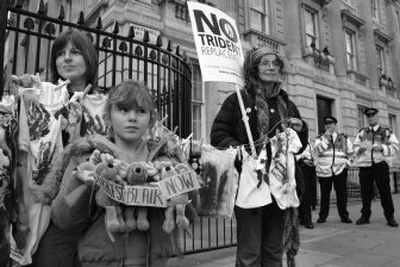 
Protesters stage a demonstration against modernizing Britain's nuclear-armed submarine fleet   outside British Prime Minister Tony Blair's  residence  in London on Wednesday. Blair's Labor Party rebelled against him in Parliament, where the measure passed with the help of the Conservatives. 
 (Associated Press / The Spokesman-Review)