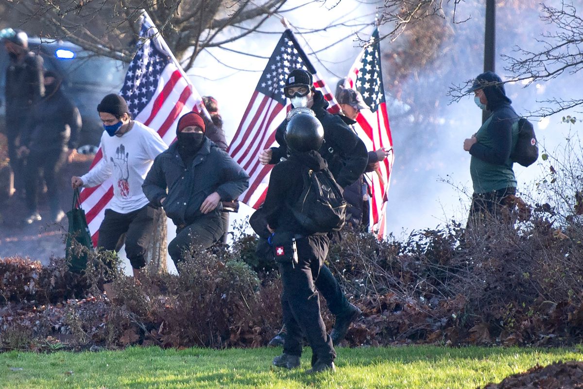 Supporters of President Donald Trump and antifa supporters clashed with Washington state police on Dec. 12 on the state Capitol Campus in Olympia. Police in Olympia declared a riot and arrested at least one person as groups with different points of view held simultaneous protests.  (MBO)