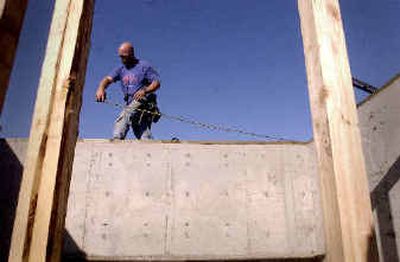 
Jeff Phillips of High Country Framing and Siding starts the framing on a new home in Hayden, where the city planning commission is preparing the city's comprehensive plan for public meetings Saturday and Monday. Rapid growth and a fight over zoning changes requested by Wal-Mart has been the impetus to complete the plan. 
 (Jesse Tinsley / The Spokesman-Review)