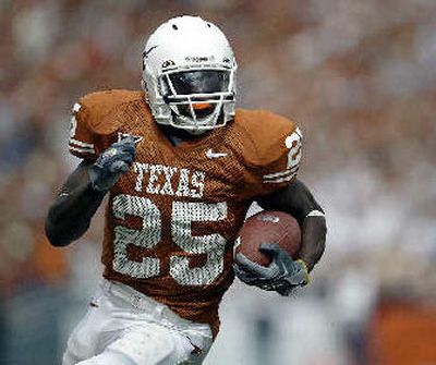 
Texas running back Jamaal Charles found lots of room to run.
 (Associated Press / The Spokesman-Review)