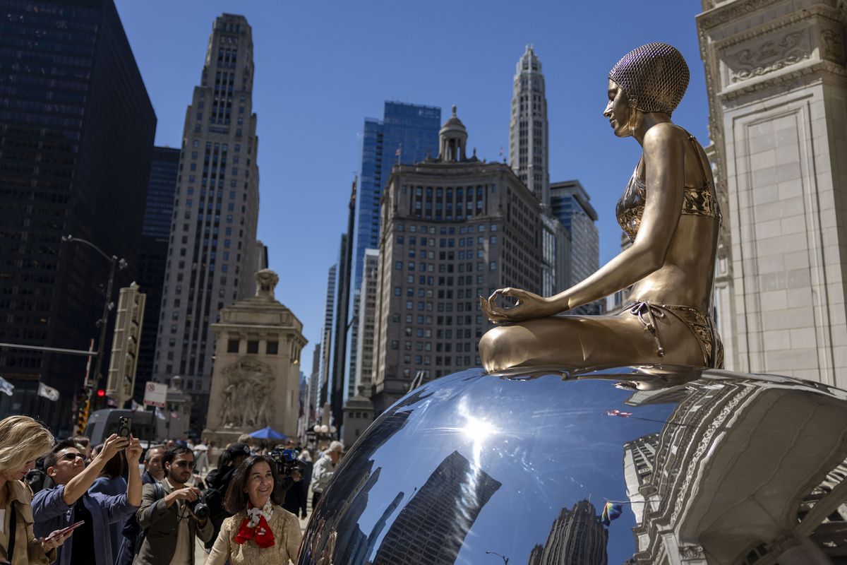 Justice is one of a series of swimmer sculptures by artist Carole Feuerman installed Tuesday, June 2, 2026, along North Michigan Avenue in Chicago. Ten outdoor art exhibit will line the Magnificent Mile into the fall. (Brian Cassella/Chicago Tribune/TNS)  (Brian Cassella/Chicago Tribune/TNS)