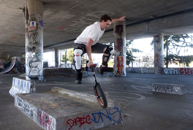 Phil Sanders, 26, performs a trick off an obstacle with his unicycle at the skate park under the freeway near Fourth Avenue and McClellan Street in Spokane on Wednesday. Sanders said he isn’t intimidated by the people who hang out there. (Jesse Tinsley)