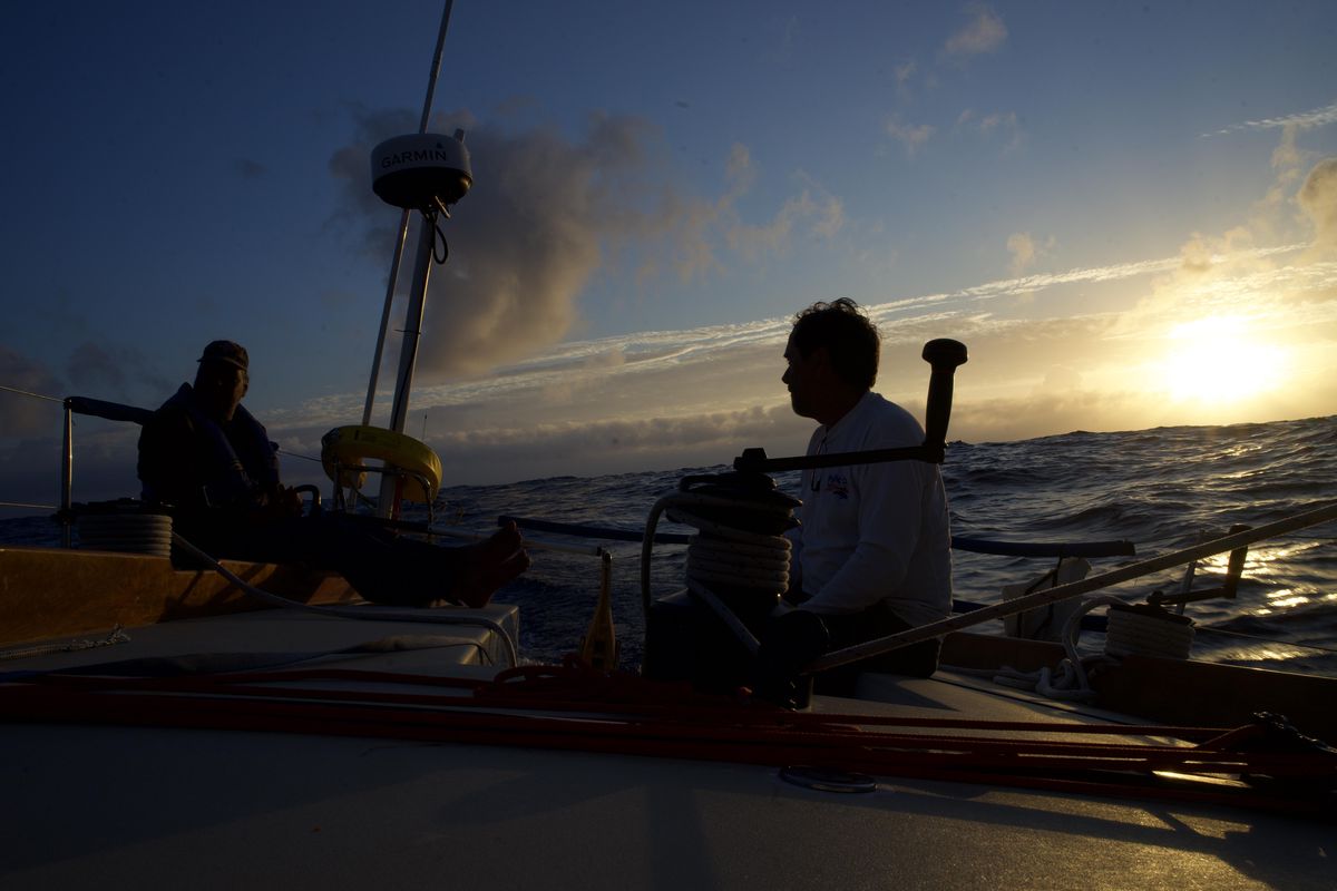 Sunset on Rage is one of the few times when all the sailors are together. Nelson Rolens, left, chats with Dave Moran. The two are life-long sailors, family friends and mentors of mine. (Will Campbell / The Spokesman-Review)