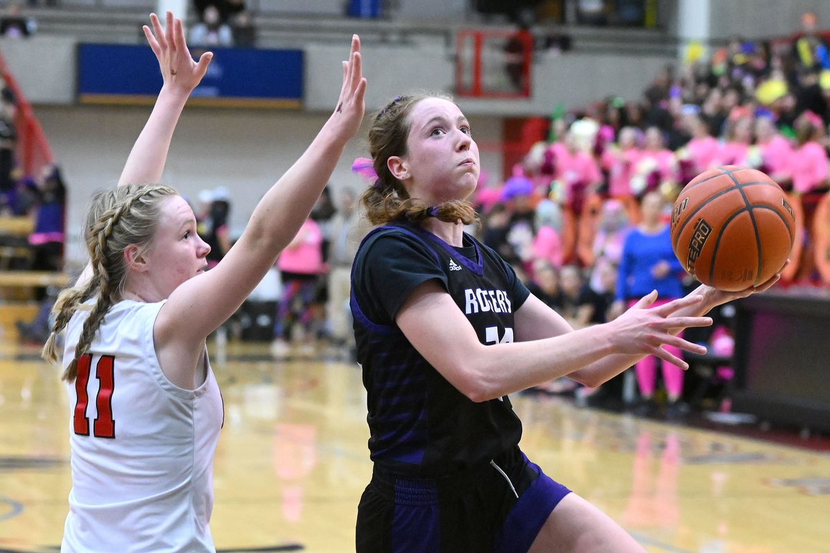 Rogers High School post Emily Peabody (20) shoots the ball against Cheney High School Kayelee Kohlman (11) during the The Railroad Rumble girls game at Reese Court on Weds. Jan.31, 2024 in Cheney WA.  (James Snook)