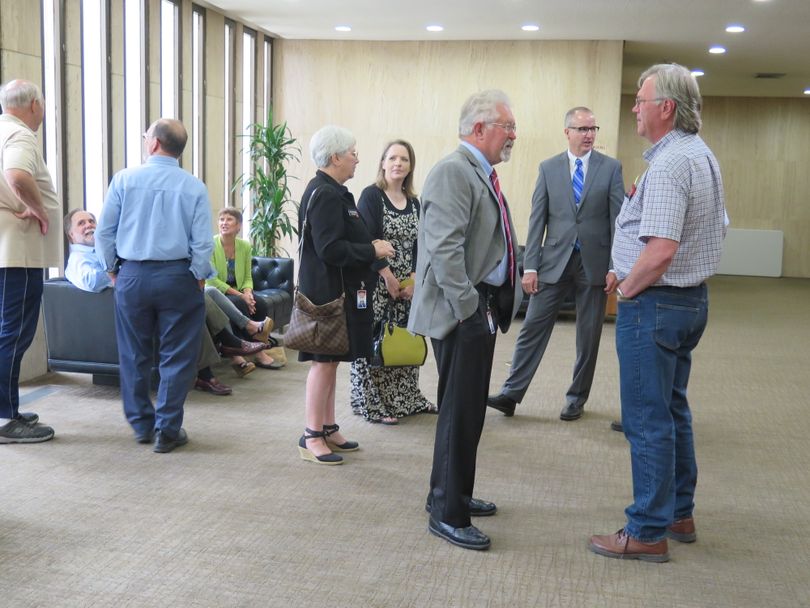 Lawmakers and others gather outside the Idaho Supreme Court's courtroom in Boise on June 15, 2017 before arguments in the grocery tax case, in which lawmakers are suing in an attempt to invalidate Gov. Butch Otter's veto of legislation to repeal Idaho's 6 percent sales tax on groceries. (Betsy Z. Russell)