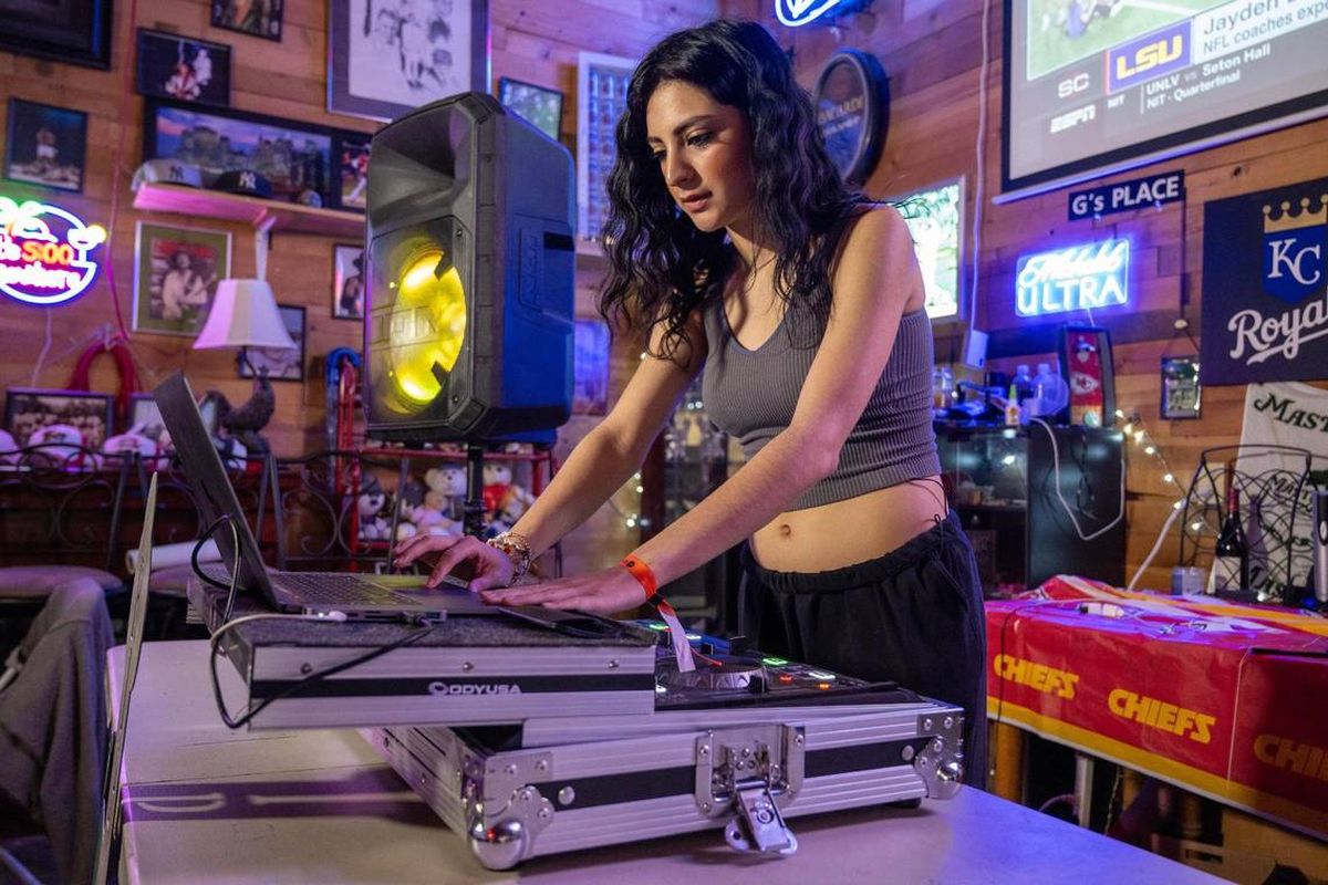 “I kind of just wanted to honor her and keep her legacy going,” said Adriana Galvan, 19, with her mother’s laptop and DJ mixing board inside the family’s party room. Her mother, Lisa Lopez-Galvan, was killed by gunfire at the Chiefs Super Bowl rally. On Saturday, Adriana will DJ at an event in her mother’s stead.  (Tammy Ljungblad/Kansas City Star/TNS)