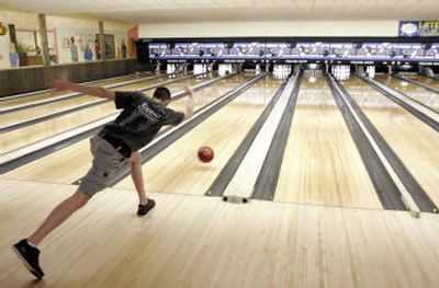 
Jimmy Lovett, 17, rolls one down the lane at Poelking Lanes in Dayton, Ohio. Teenagers are pumping new life into the bowling business.
 (Associated Press / The Spokesman-Review)