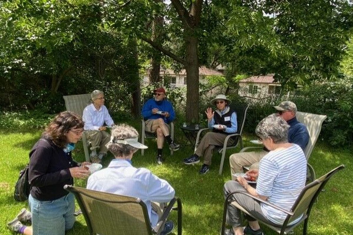 Sharing produce from their garden, members in a Spokane cohousing group enjoy a June 24 potluck for the first time since the pandemic started.  (Courtesy of Mariah McKay)