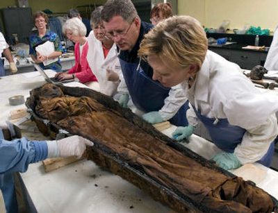 
A team from the National Museum of Natural History examines the remains.
 (Ken Rahaim/Smithsonian Institution / The Spokesman-Review)