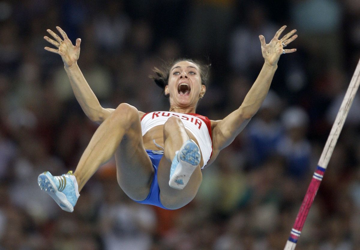 Associated Press Russia’s Yelena Isinbayeva clears the bar to break her world record as she wins gold in the women’s pole vault final. (Associated Press / The Spokesman-Review)