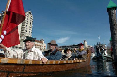 
From left, Dean Bakke, Don Smith, Bob Twyman and Mark Weadick carry lake water as they paddle away from the Third Street docks in Coeur d'Alene on Saturday. 
 (Jesse Tinsley / The Spokesman-Review)