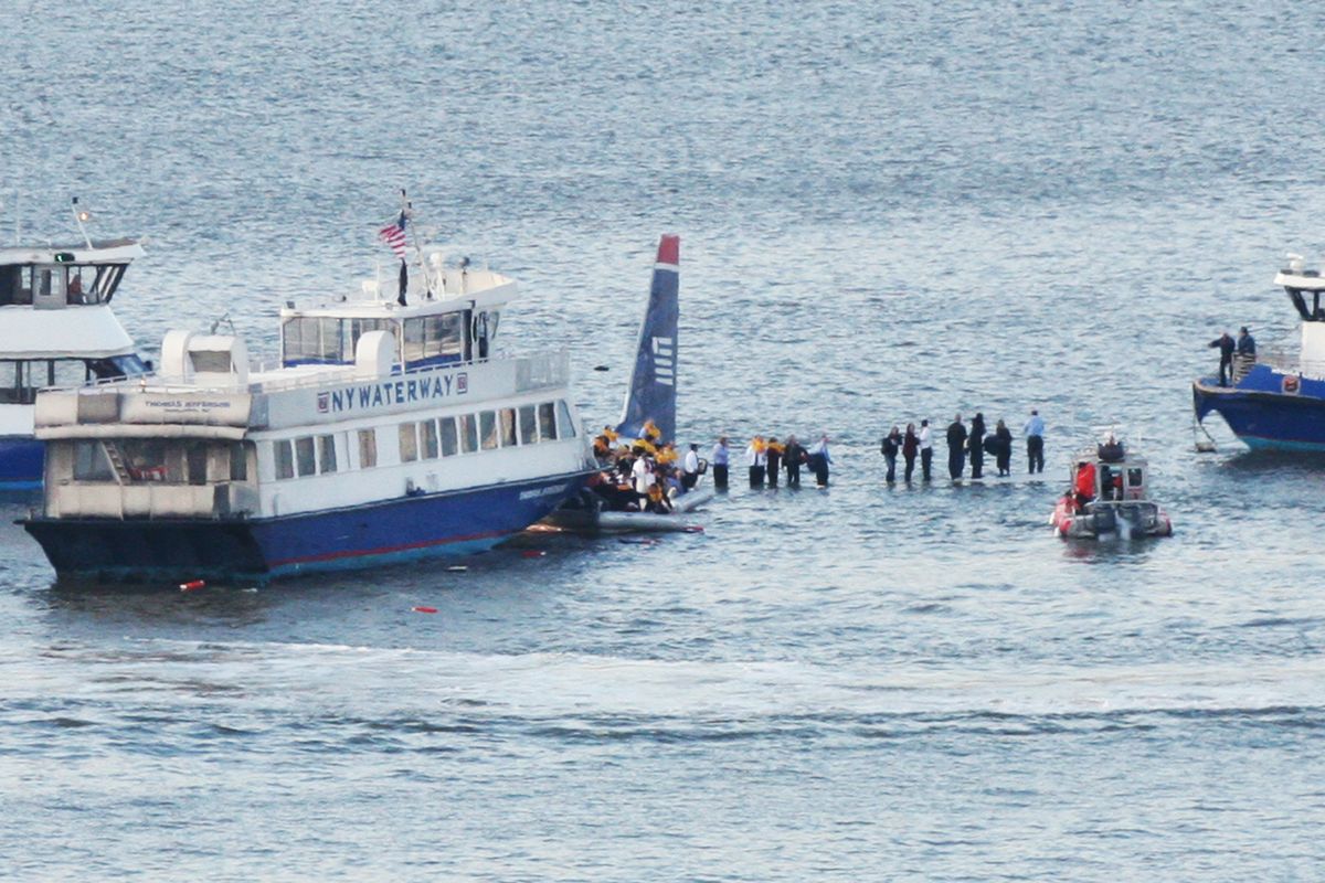 Ferry boats surround a US Airways aircraft that has gone down in the Hudson River in New York, Thursday, Jan. 15, 2009. It was not immediately clear whether there were injuries. (Bebeto Matthews / Associated Press)