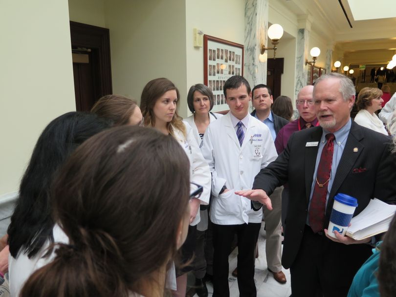 Sen. Marv Hagedorn, right, talks with doctors and health care advocates after his $10 million health gap bill cleared a Senate committee on Thursday, March 9, 2017. (Betsy Z. Russell)