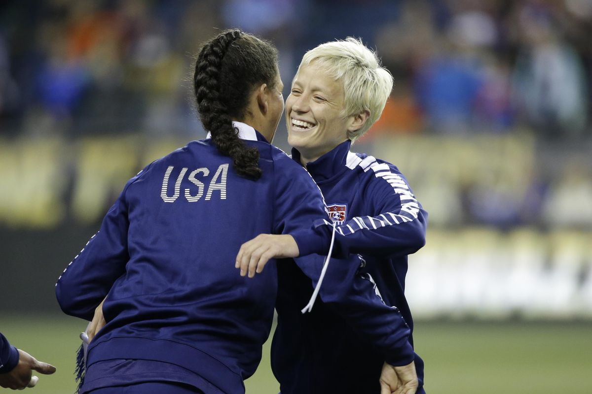 Megan Rapinoe, right, is not expected to play in the U.S. team’s early games at Rio as she recovers from a torn ACL. (Elaine Thompson / Associated Press)