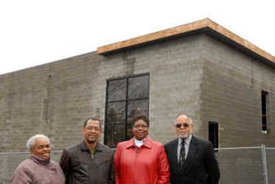 
Mary Langford, Charles Williams, Betsy Wilkerson and the Rev. Paul Smith stand in front of the Emmanuel Family Life Center. They are volunteers working on the new Richard Allen Enterprises project  under construction  near Bethel AME Church in Spokane. 
 (Brian Plonka / The Spokesman-Review)