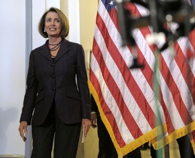 Nancy Pelosi walks to a news conference on Capitol Hill Wednesday after being re-elected leader of House Democrats.  (Associated Press)